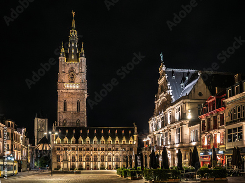 Illuminated Historic Buildings and Saint Bavo's Cathedral at Night in Ghent, Belgium