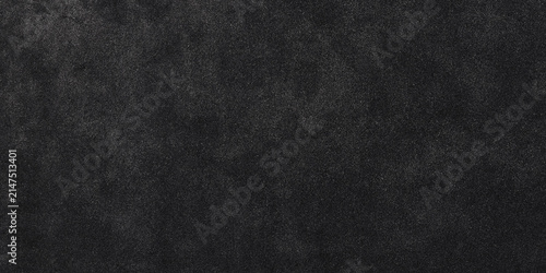 Black asphalt texture background. Dark grainy road surface pattern for design.