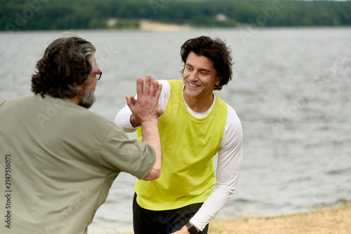 Photography Father and son celebrating fitness success together