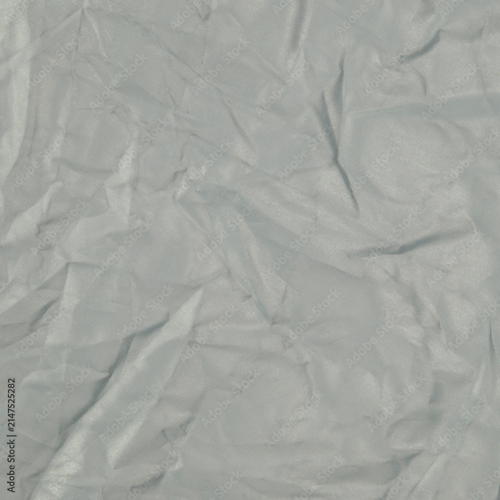 Fototapeta premium light silver crumpled surface with smooth soft creases