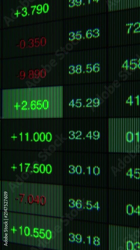 Dynamic Stock Market Display Showing Financial Data Trends with Green and Red Numbers on a Dark Background, Emphasizing Market Fluctuations and Trading Activity