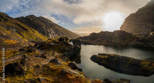 Bild auf Leinwand Panoramic view of glacial lake in Coum Faha valley on Mount Brandon Kerry Irelan