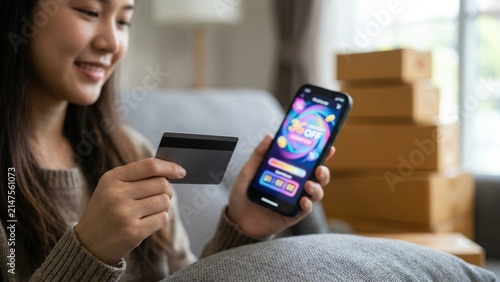 Finance - Asian woman using credit card for online shopping at home