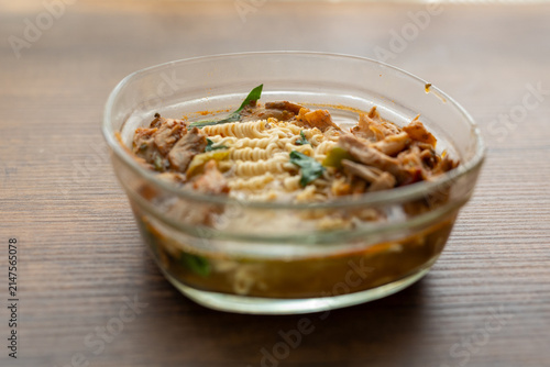 Close-up of mushroom ramen soup served in transparent glass bowl