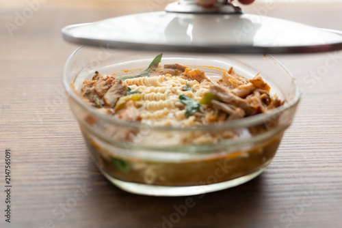 Close-up of mushroom ramen soup served in transparent glass bowl