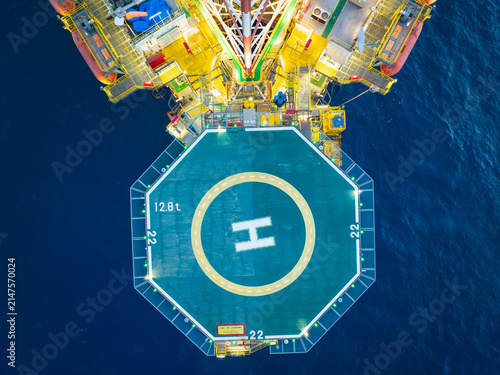 Aerial View of Offshore Jack-Up Rig and Production Platform at Sunset.