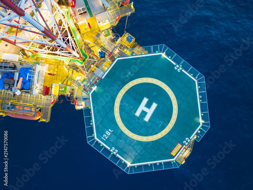 Aerial View of Offshore Jack-Up Rig and Production Platform at Sunset.