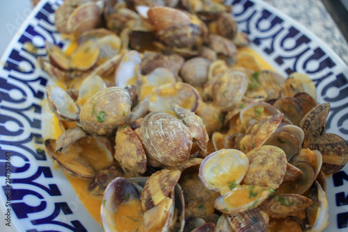 Freshly Prepared Clams in Creamy Sauce Served on a Patterned Platter