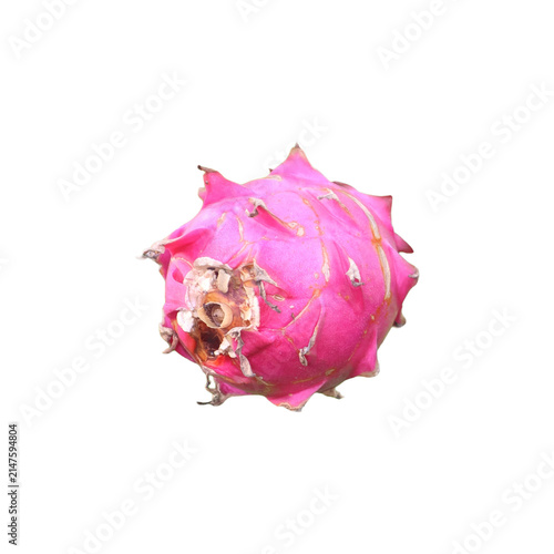 Vibrant pink dragon fruit isolated with selective focus against a bright studio light