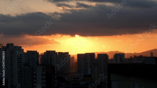 View of the sunset from a terrace between buildings in the Lapa neighborhood of Sao Paulo, Brazil.
