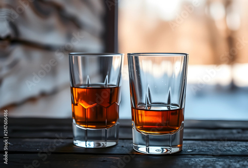 Two whiskey glasses with am...