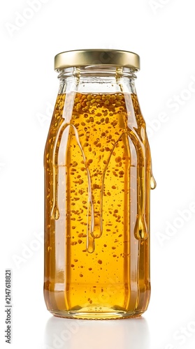 Clear Glass Bottle Filled with Golden Honey Dripping Down the Sides