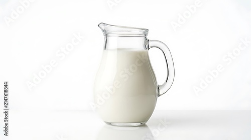 Clear Glass Pitcher Filled With White Milk Isolated On White Background