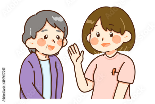 高齢者と相談する女性介護スタッフのイラスト