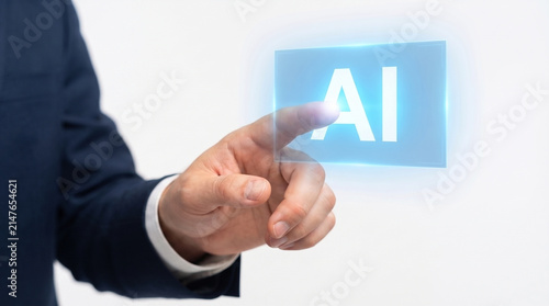 Photo, close-up, hand pointing at a virtual screen displaying the text “AI” (artificial intelligence), company employees, businesspeople, white background  