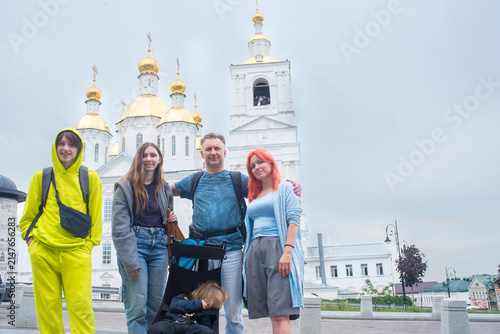 Happy big family in Arzamas city on Greater Golden Ring of Russia route near orthodox church