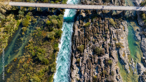 Konstfotografi Bunski kanal bridge spanning vibrant river rapids