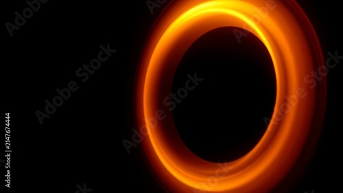Abstract glowing orange golden ring on black background