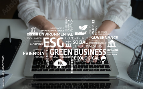 Принти на полотні This stock photo captures hands typing on a laptop, surrounded by keywords related to ESG principles, emphasizing sustainable practices and ethical investing in business