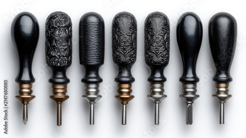 Set of seven leather crafting awls with textured black handles
