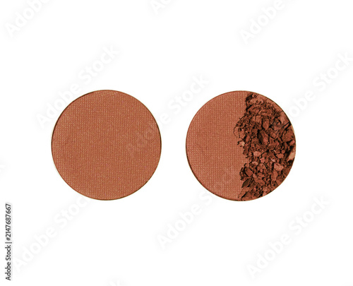 Brown blusher or eyeshadow refills vivid powder round form isolated on white background. Beauty product cosmetic powder for makeup with pressed matte texture and broken particles, top view objects.