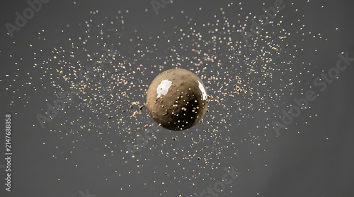 Muddy water droplet impact creating a dynamic splash with scattered particles