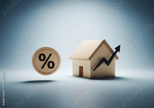 Real estate market growth concept with wooden house model black rising arrow and percentage symbol representing mortgage rates and investment.