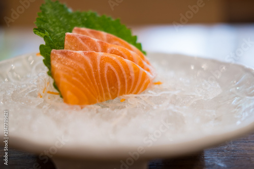 Salmon sashimi slice fresh serve on ice. Close up