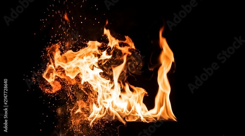 Dynamic inferno of vibrant orange and yellow flames dancing passionately against a dark backdrop, creating an intense and energetic display of heat and light