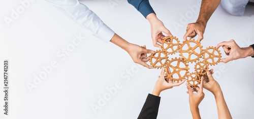 Foto Business Team Connecting Wooden Gears for Teamwork, Collaboration, Strategy and