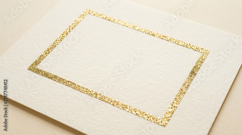 Elegantly Textured Cream Paper Card Mockup with Sparkling Gold Glitter Frame Border