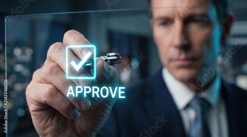 Digital Approval: A focused businessman meticulously approves a digital document, represented by a glowing checkbox and the word APPROVE on a transparent screen.