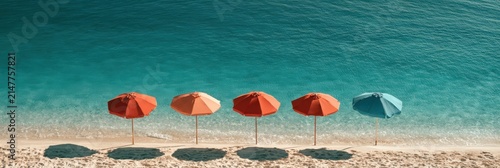 A serene beach scene with five colorful umbrellas lined up on sandy shore against clear turquoise ocean water.