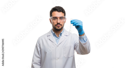 Scientist in lab coat holding a blue nitrile glove