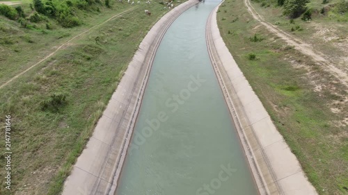 Large irrigation canals in rural Thailand are used to transport water for agriculture and for the daily needs of the people.