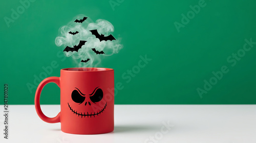 Halloween party backdrop minimal. Minimal halloween party backdrop with spooky red mug and dark bat smoke . Scarey creepy skittish festive holiday. decoration wallpaper banner, copy space