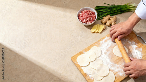 Chef Rolling out Dumpling Wrappers Flatlay Mockup