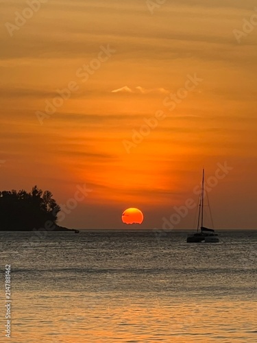 sunset over the sea in kamala beach phuket thailand