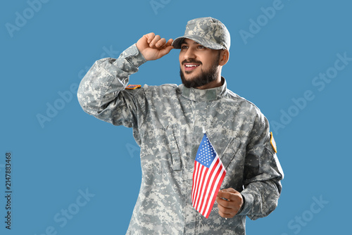 Soldier with USA flag on blue background. Labor Day celebration