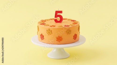 Orange Five Year Anniversary Cake with Maple Leaf Decorations on White Stand, Yellow Studio Background