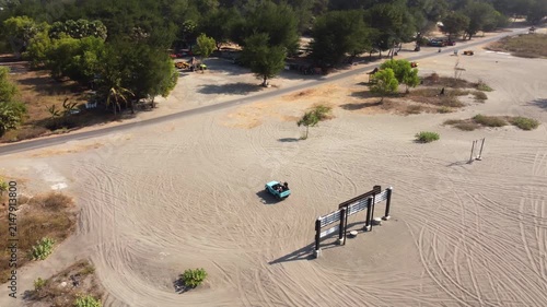 Aerial View of Tourists Taking Photos with Off Road Vehicle at Gumuk Pasir Parangkusumo Sand Dunes