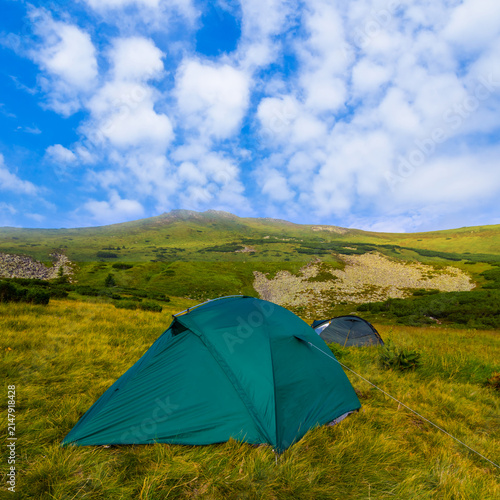 touristic camp stay among green mountains, summer mountain travel scene