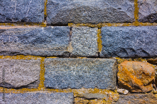 closeup wall from stones, outdoor architecture background