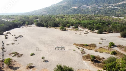 Aerial View of Gumuk Pasir Barchan Sand Dunes with Hills and Coastal Forest in Yogyakarta, Indonesia