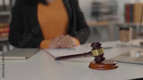 Female judge presiding in courtroom awaiting trial