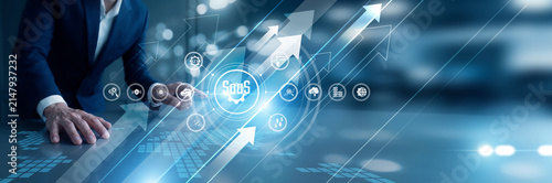 IT manager hand touch Software as a Service platform managing cloud subscriptions and users. On-demand delivery of applications reduces infrastructure costs and boosts team flexibility.
