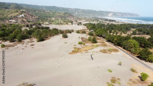 Aerial View of Gumuk Pasir Parangkusumo Sand Dunes, Coastal Village and Parangtritis Beach in Yogyakarta