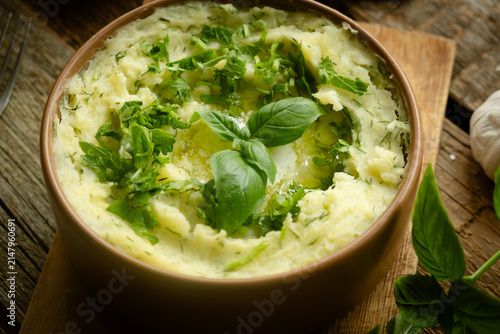 Quadro su tela Dish of creamy mashed potatoes topped with a sprinkle of fresh herbs