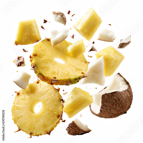 Pineapple slice and coconut pieces floating isolated on transparency background, fresh tropical fruit mix with vibrant colors and juicy texture isolated on transparent background