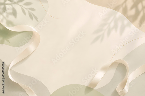Minimalist flat lay with elegant white satin ribbon, soft pastel geometric paper shapes and delicate natural shadows. Premium neutral background with copy space for branding, product presentation 
